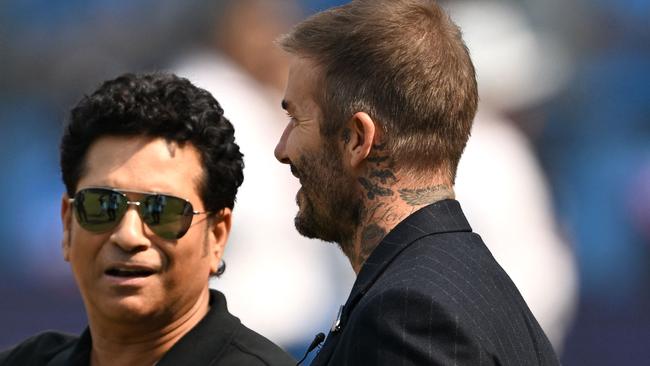 Tendulkar and Beckham chat. Photo by Punit PARANJPE / AFP