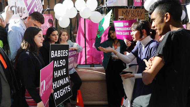 Pro life and pro choice protestors gathered at the front of NSW State Parliament in Sydney ahead of the debate of a possible abortion bill.Picture: Richard Dobson