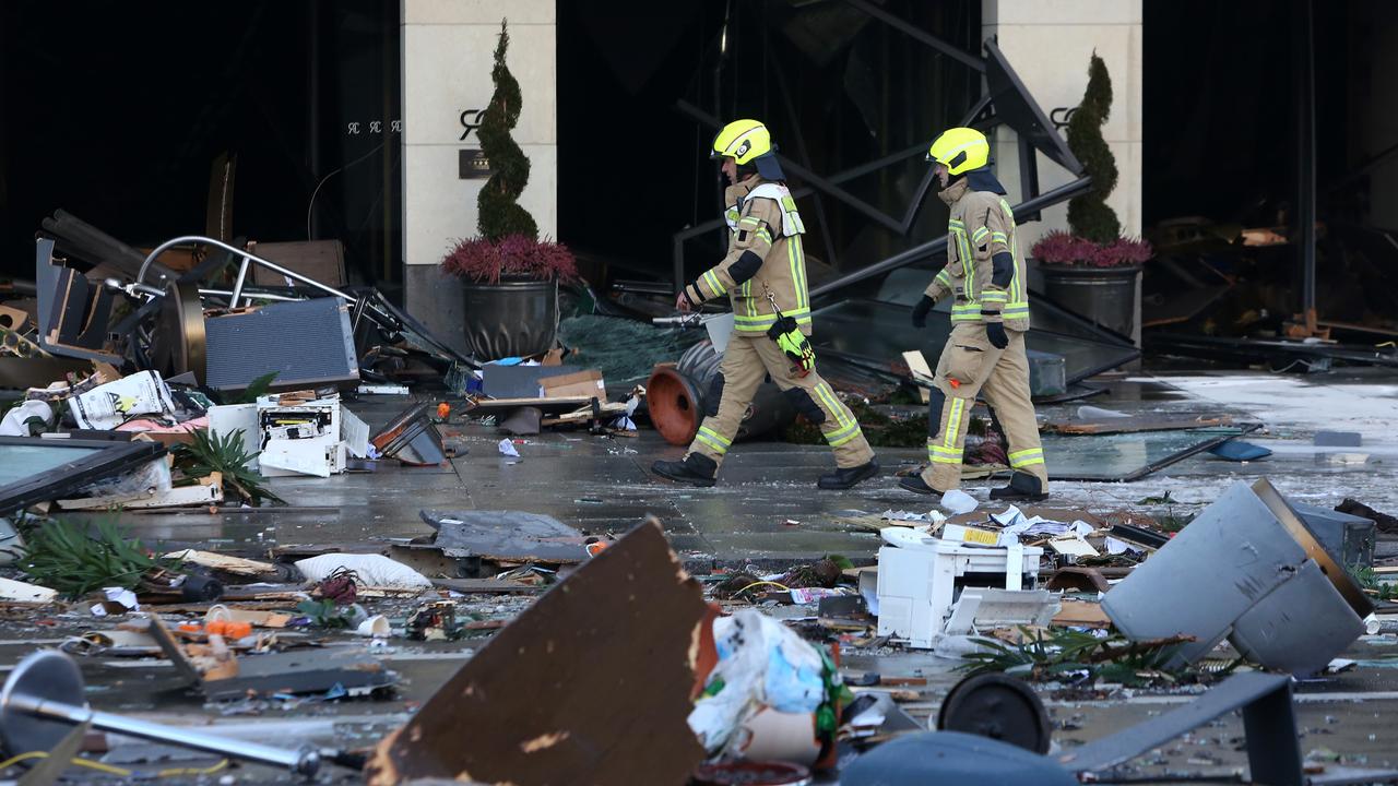 Emergency workers respond at the scene of a broken giant aquarium. (Photo by Adam Berry/Getty Images)