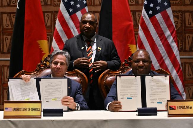 US Secretary of State Antony Blinken (L), Papua New Guinea Defence Minister Win Bakri Daki and Prime Minister James Marape at the security pact signing in May