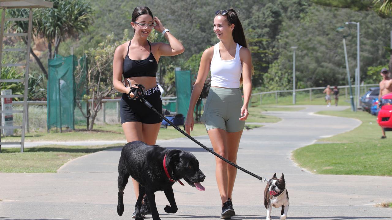 Chelsea Ribeiro-Bates and Summer Pitts from Broadbeach,with dogs Hugo and Archie. Picture Glenn Hampson