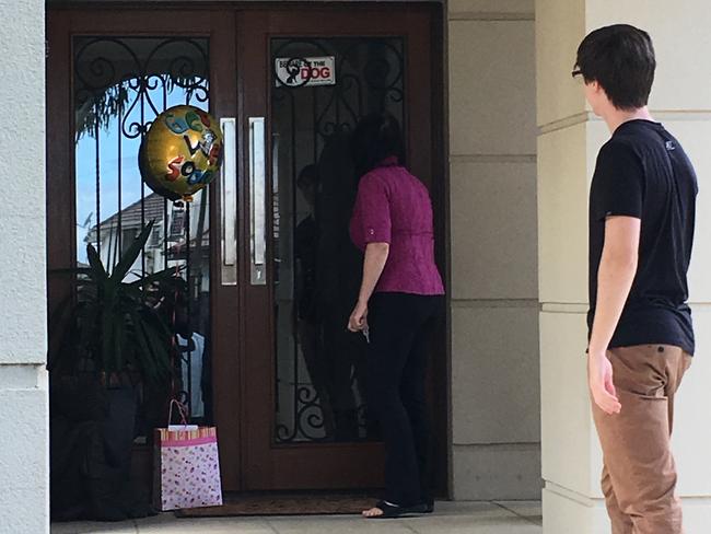 Neighbour Violeta leaves a balloon for the family after the horrific attack.