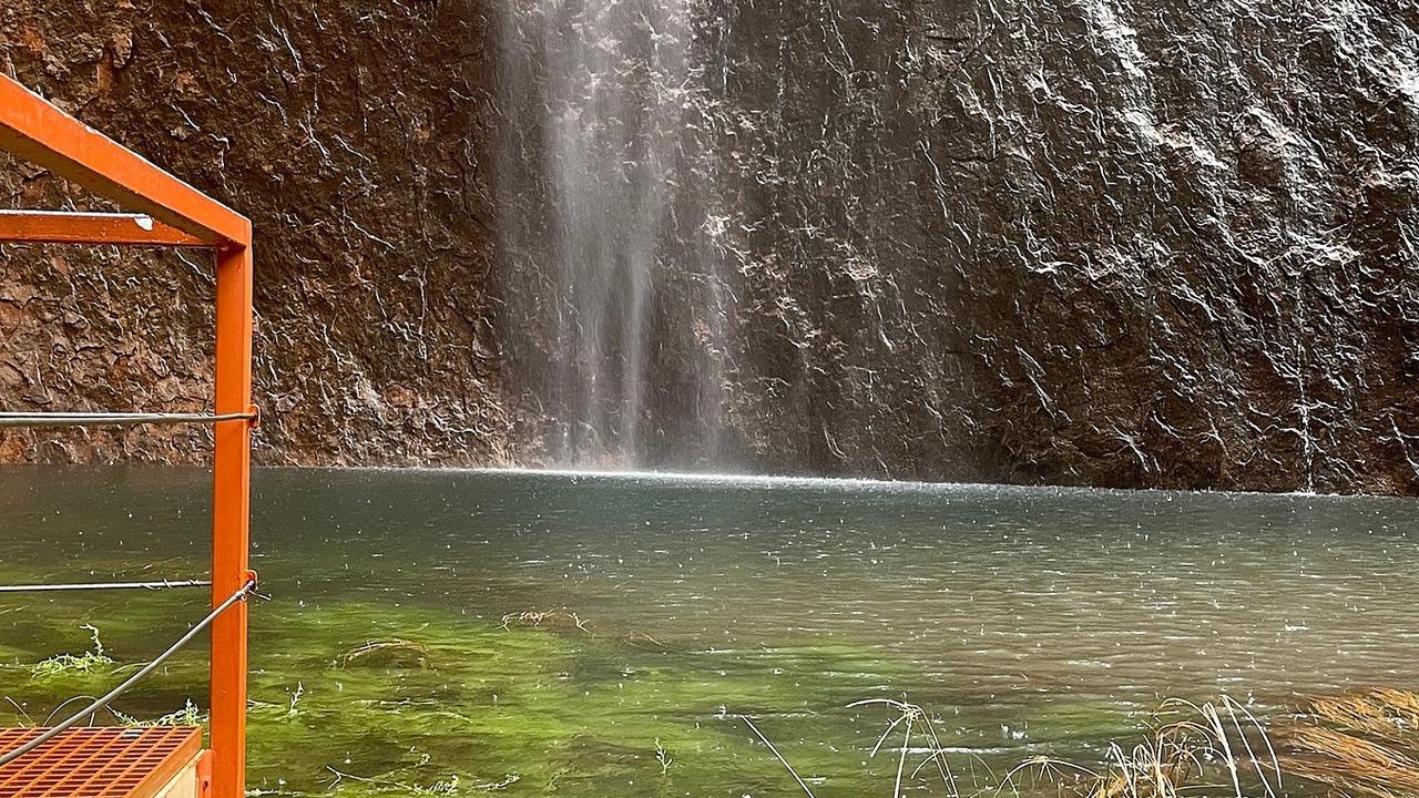 So much rain fell on Uluru on Tuesday night that one of the viewing platforms was almost underwater. Picture: Parks Australia/Ranger Meegan