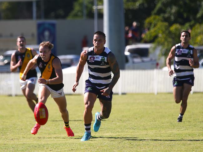 Pictured: Tigers forward James Neale and Crocs midfielder Liam Brandt. Port Douglas Crocs v North Cairns Tigers at Port Douglas Sporting Complex. Round 9 AFL Cairns 2024. Photo: Gyan-Reece Rocha