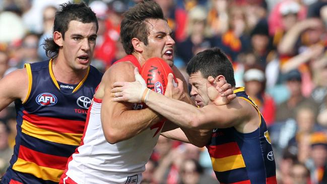 Taylor Walker and Ian Callinan grab Josh Kennedy. Picture: Simon Cross.