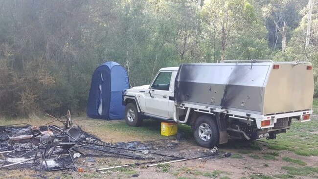 Russell Hill and Carol Clay’s burnt-out campsite near Dry River in the Wonnangatta Valley. Picture: ABC