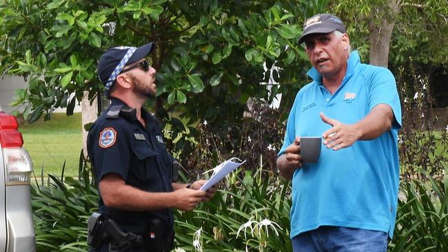 Former Northern Land Council member Paul Henwood speaks with police after being kicked out of the Northern Land Council briefing on Thursday. Picture: Katrina Bridgeford