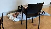 A patient on the floor at Gold Coast University Hospital’s Emergency Department.