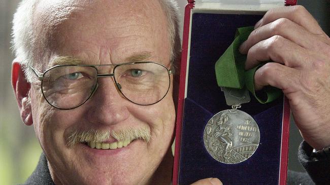 Peter Norman with his silver medal in 2000.