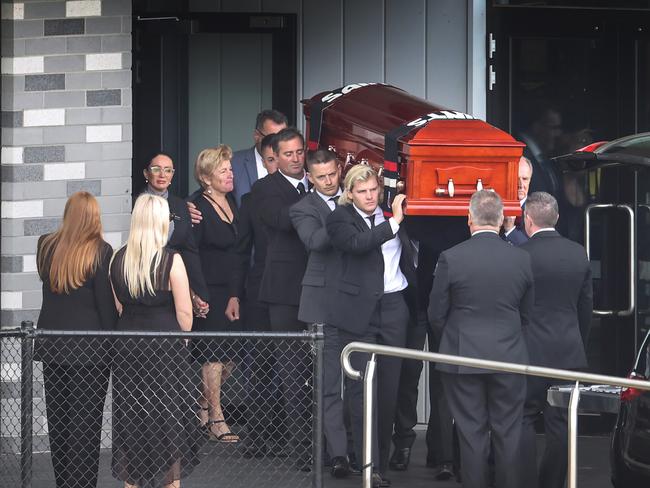 Jackson Warne helps carry his dad’s coffin. Picture: David Caird.