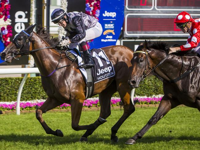 Jockey Jeff Lloyd riding Houtzen wins the Magic Millions 2YO Classic at the Magic Millions racing carnival at the Gold Coast Turf Club on the Gold Coast, Saturday, Jan. 14, 2017. (AAP Image/Glenn Hunt) NO ARCHIVING, EDITORIAL USE ONLY