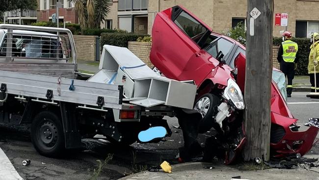 Emergency services at the scene of a crash on Denison St, Hamilton. Picture: Dan Proudman