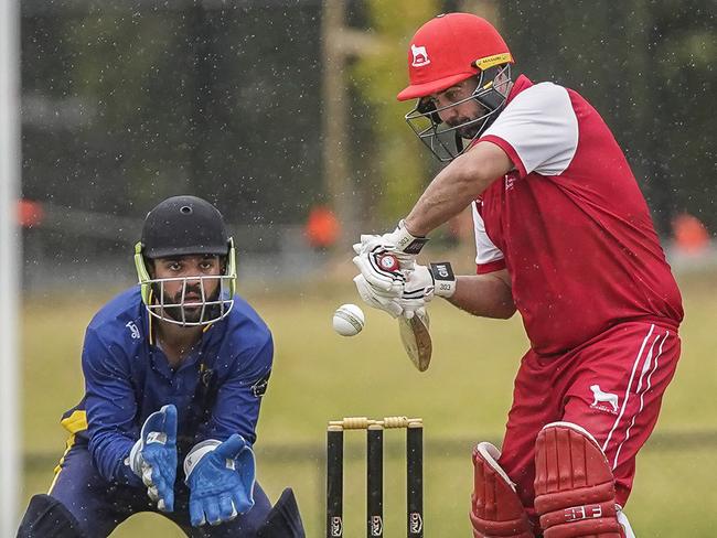 Mordialloc batsman Liam Bence on his way to a defiant 24 not out as Dingley keeper Mark Fitch looks on. Picture: Valeriu Campan