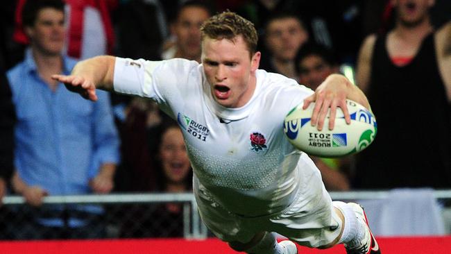 England’s wing Chris Ashton scores a try during the 2011 Rugby World Cup.