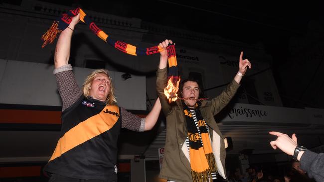 Tiger supporters could be seen burning an Adelaide Crows scarf.