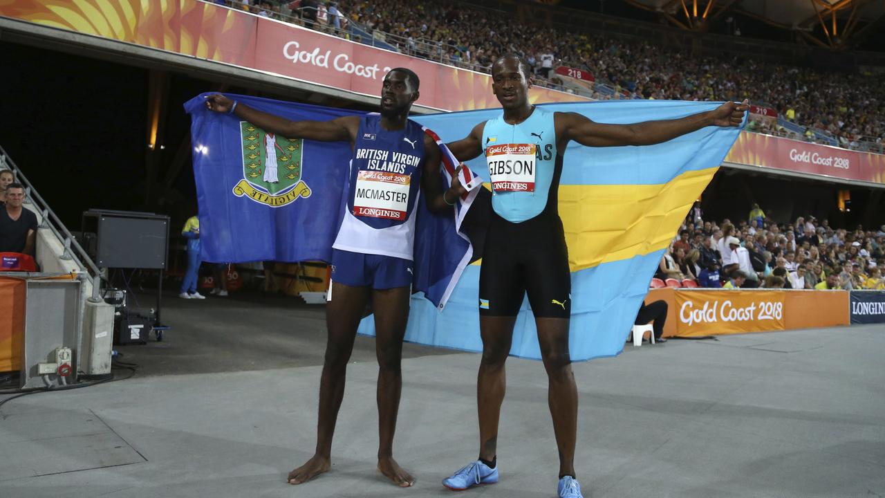 Kyron Mcmaster of the British Virgin Islands, left, and the Bahamas' Jeffery Gibson celebrate their gold and silver medals