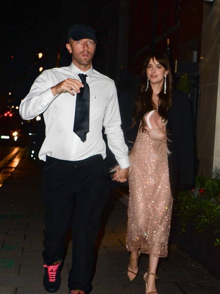 Chris Martin and longtime girlfriend Dakota Johnson. Picture: TJ / BACKGRID