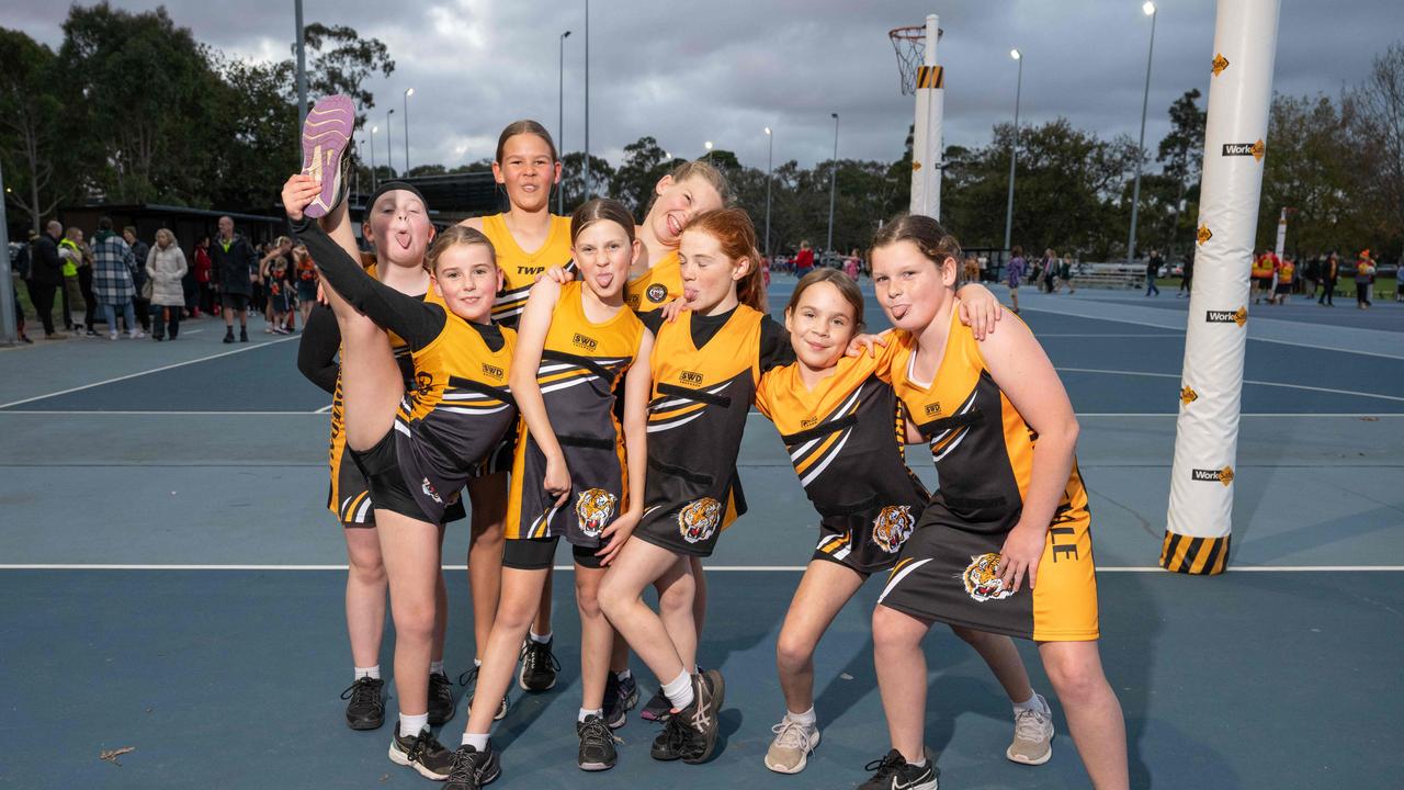 Grovedale Yellow under-11 netball team pull their funniest faces.