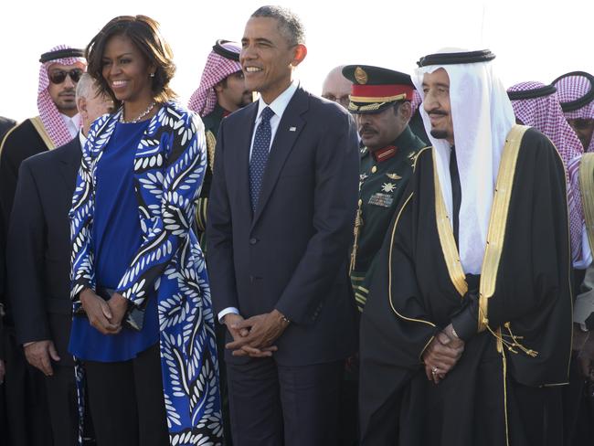 2015: President Barack Obama and first lady Michelle Obama stand with new Saudi King Salman bin Abdul Aziz they arrive on Air Force One at King Khalid International Airport, in Riyadh, Saudi Arabia. Picture: Carolyn Kaster)