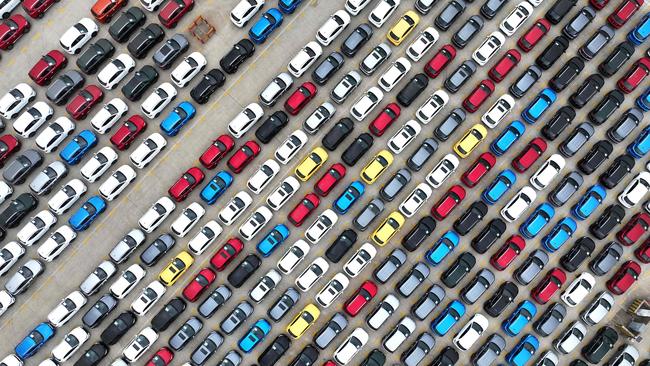 TOPSHOT - This photo taken on January 23, 2025 shows cars waiting to be exported in a port in Lianyungang, east China's Jiangsu province. (Photo by AFP) / China OUT