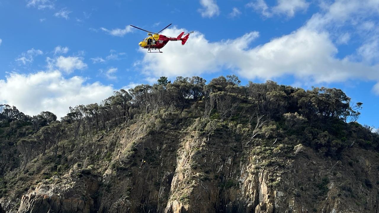 Swimmer, 21, rescued after becoming stranded on rocks