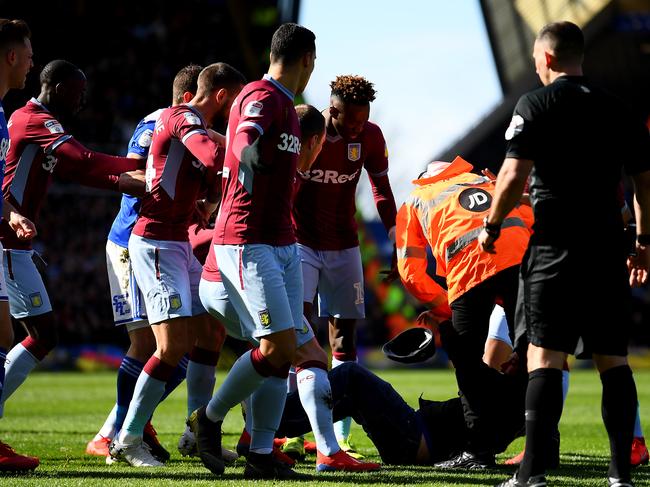 BIRMINGHAM, ENGLAND - MARCH 10: A pitch invader is tackled by a steward after striking Jack Grealish of Aston Villa during the Sky Bet Championship match between Birmingham City and Aston Villa at St Andrew's Trillion Trophy Stadium on March 10, 2019 in Birmingham, England. (Photo by Alex Davidson/Getty Images)