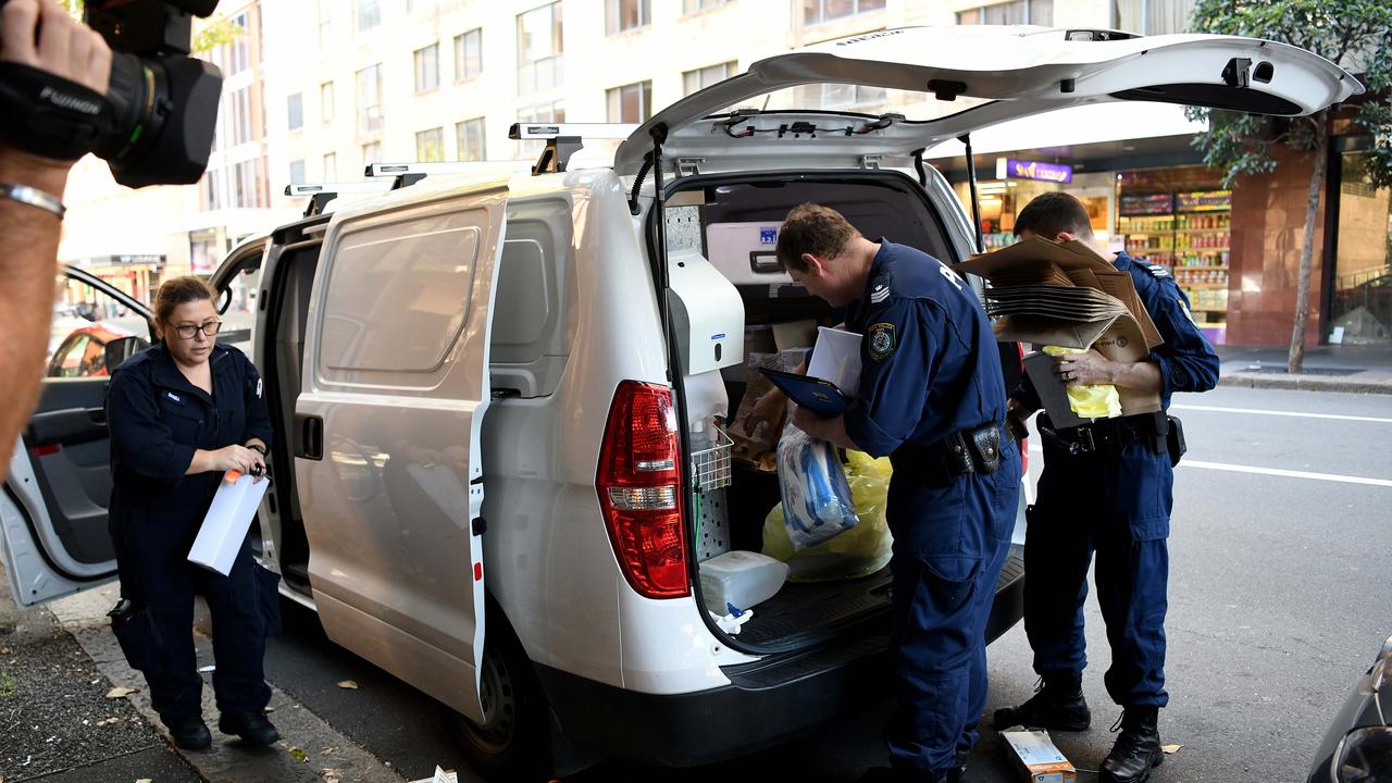 NSW Police carry bags of evidence bags from the Oaks Hotel on Castlereagh Street in Sydney after a man was killed in the building. Picture: NCA NewsWire/Bianca De Marchi.