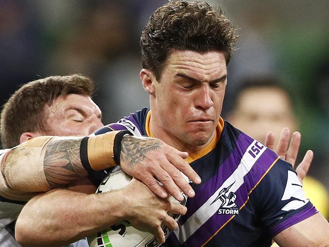 MELBOURNE, AUSTRALIA - SEPTEMBER 06: Brodie Croft of the Storm runs with the ball whilst being tackled during the round 25 NRL match between the Melbourne Storm and the North Queensland Cowboys at AAMI Park on September 06, 2019 in Melbourne, Australia. (Photo by Daniel Pockett/Getty Images)