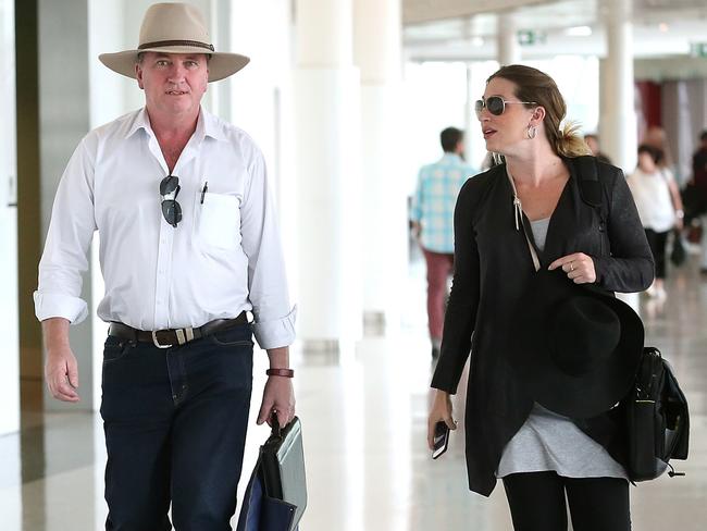 Former Deputy Prime Minister Barnaby Joyce and pregnant partner Vikki Campion make their way through Canberra airport this month. Picture: Kym Smith