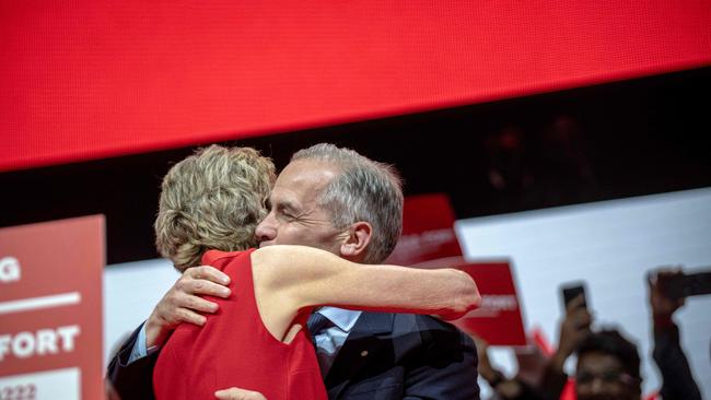 Mark Carney hugs his wife after winning the Canadian Federal Election. Picture: Andrej Ivanov/Getty Images/AFP