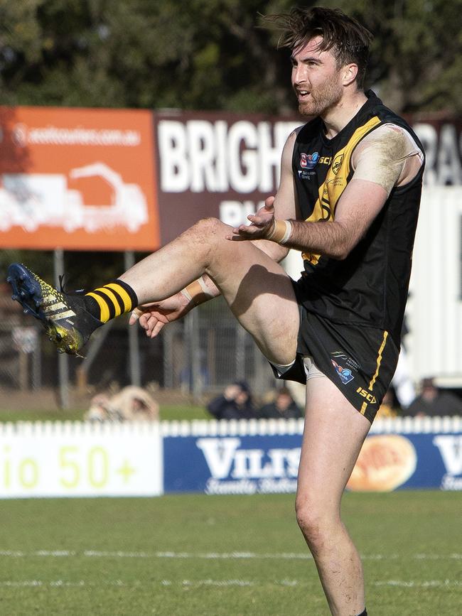 Glenelg’s Liam McBean kicks a goal against South. Picture: Emma Brasier