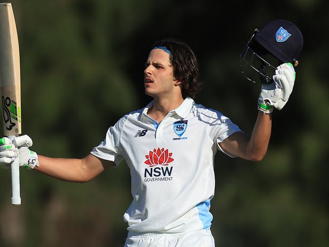 SYDNEY, AUSTRALIA - OCTOBER 10: Sam Konstas of the Blues raises his bat in the air after hitting a six to reach his century during the Sheffield Shield match between New South Wales and South Australia at Cricket Central, on October 10, 2024, in Sydney, Australia. (Photo by Mark Evans/Getty Images)