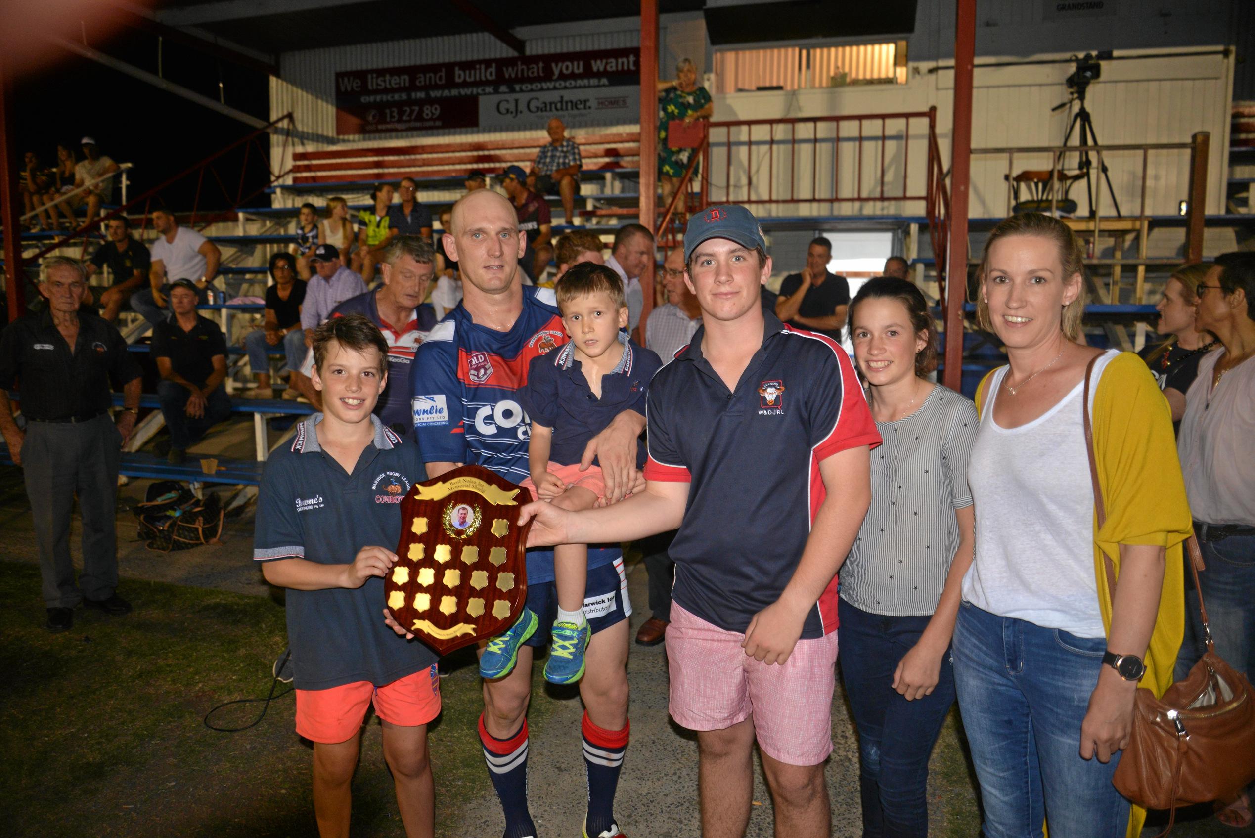 (From left) James Nolan, Warwick Cowboys captain Mick Bloomfield, William, Basil, Lily and Natalie Nolan at the presentation of the Basil Nolan Jr Memorial Shield at Father Ranger Oval. Picture: Gerard Walsh