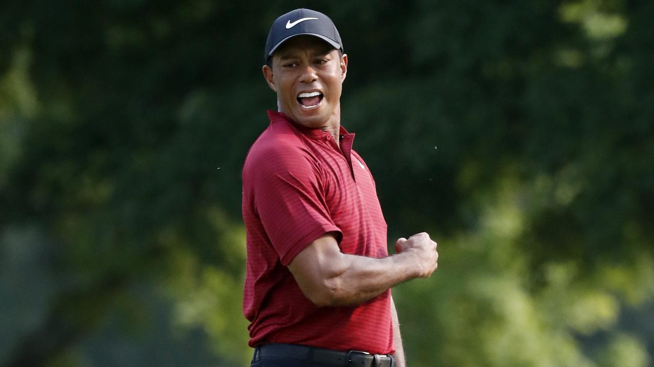 Tiger Woods celebrates at birdie at the 18th hole of the PGA Championship.