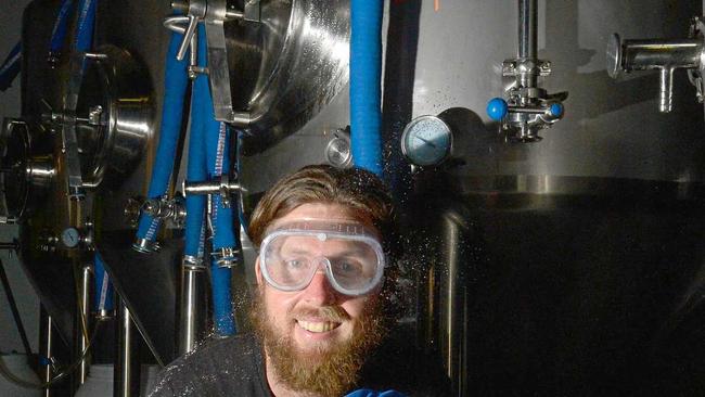 Your Mates Brewery co-owner Christen McGarry cleans a few kegs ahead of a grand opening at Warana. Picture: John McCutcheon