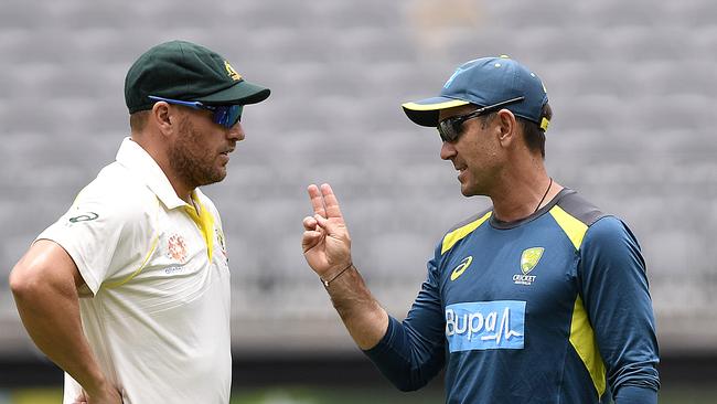 Australian captain Justin Langer speaks to Aaron Finch (left) at the change of innings on day two of the second Test match between Australia and India at Perth Stadium in Perth, Saturday, December 15, 2018. (AAP Image/Dave Hunt) NO ARCHIVING, EDITORIAL USE ONLY, IMAGES TO BE USED FOR NEWS REPORTING PURPOSES ONLY, NO COMMERCIAL USE WHATSOEVER, NO USE IN BOOKS WITHOUT PRIOR WRITTEN CONSENT FROM AAP