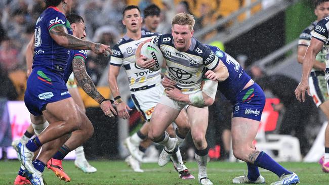 Tom Dearden of the Cowboys is tackled during the round nine NRL match between the New Zealand Warriors and North Queensland Cowboys at Suncorp Stadium on May 03, 2025, in Brisbane, Australia. (Photo by Bradley Kanaris/Getty Images)