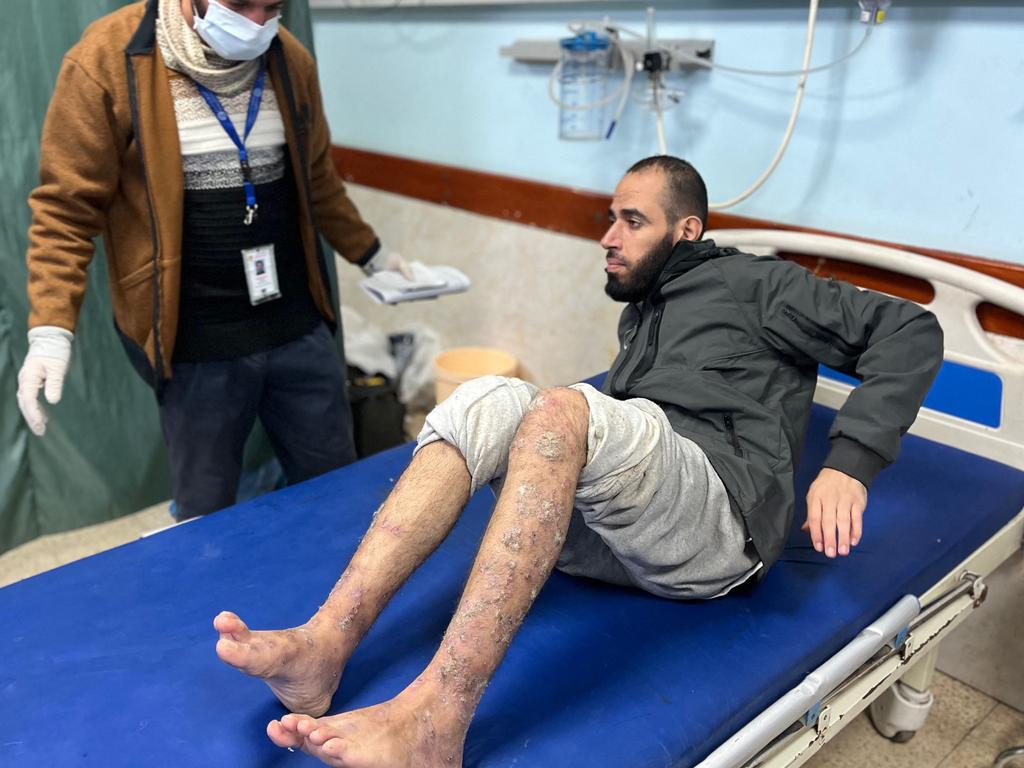 A Palestinian prisoner speaks to a doctor at the European Hospital in Khan Yunis in the southern Gaza Strip early on February 27, 2025, following his release by Israeli authorities. Picture: AFP