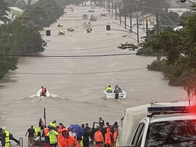 Boat crews head out into Mullumbimby flood water.