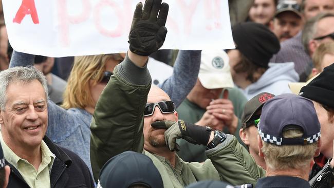 A UPF protester gives the Nazi salute. Picture: Jake Nowakowski