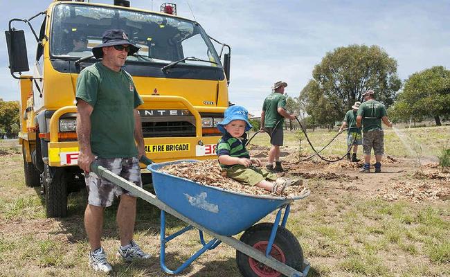 Shane Gannon and his son Chaise get their hands dirty at a Prenzlau fire brigade open day on Monday. . Picture: Contributed