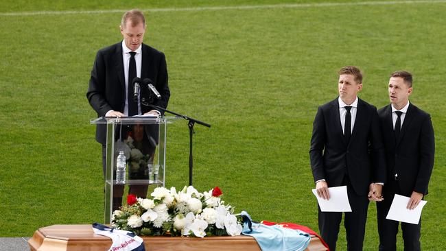 Adam Selwood delivers his eulogy as Scott and Joel Selwood look on during Troy Selwood’s funeral service. (Photo by Michael Willson/AFL Photos)