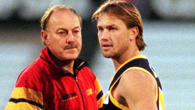 Malcolm Blight with Tony Modra in 1997. The Crows star would be axed following the finals a year later.