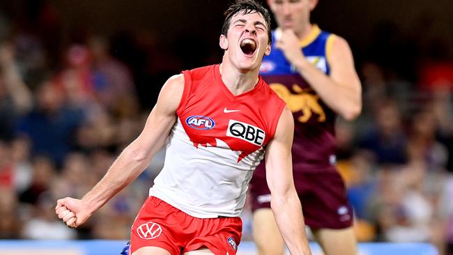 Sydney first-gamer Errol Gulden of the Swans celebrates one of his three goals.