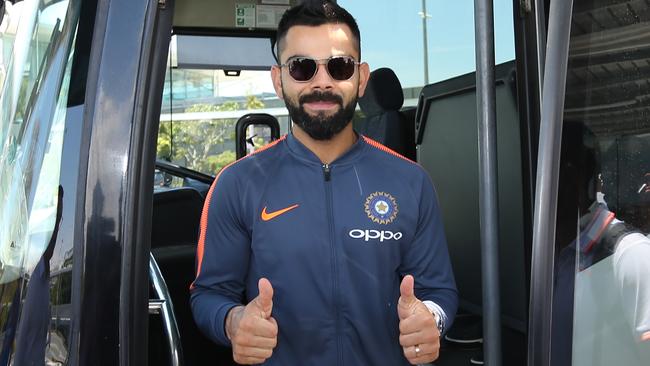 Virat Kohli gets off the bus after arriving in Australia.