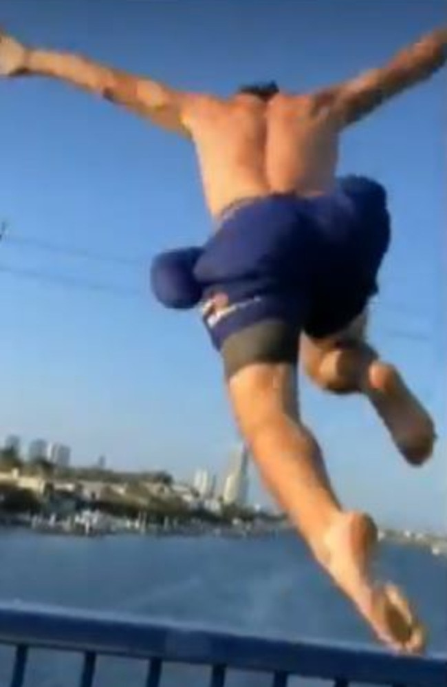 Gold Coast police say a man captured on video recently jumping from a moving car into the Nerang River off a Chevron Island bridge, and his driver, can expect a knock on the door. Picture: 9News Gold Coast