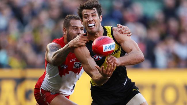 Alex Rance is tackled by Lance Franklin. Picture: Michael Klein