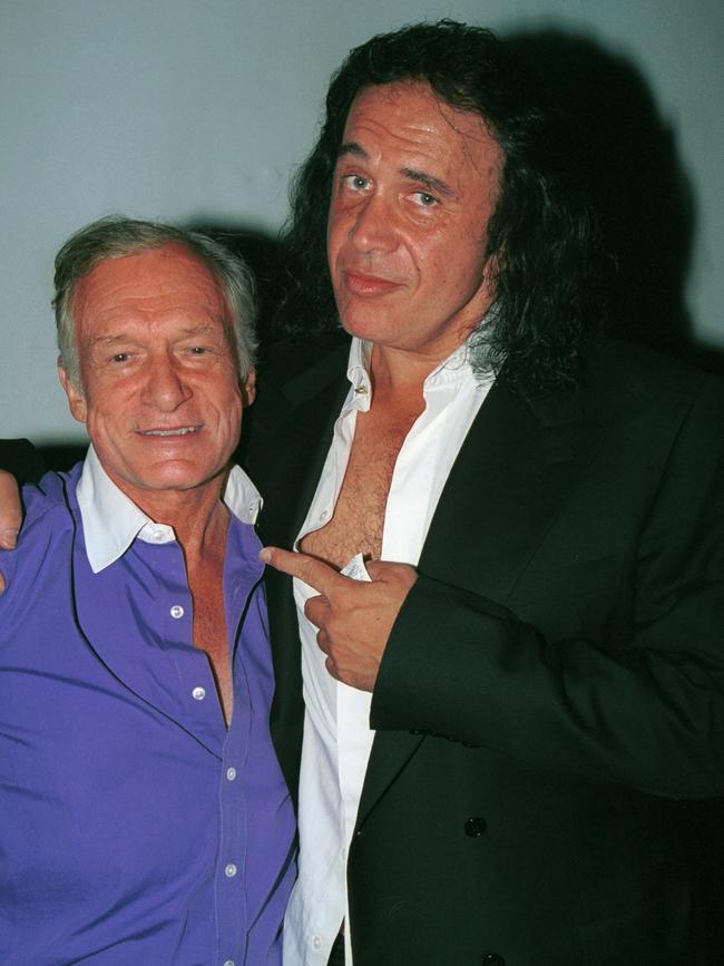 Kiss bassist Gene Simmons poses with Playboy founder, Hugh Hefner during the Tongue Magazine Fall 2002 Issue release party at Barfly on September 27, 2002 in West Hollywood, California. Picture: Getty