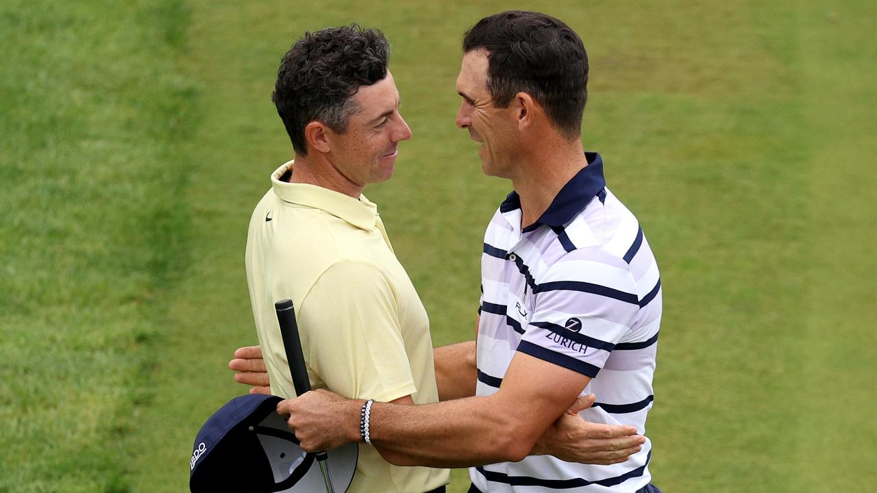 VIRGINIA WATER, ENGLAND - SEPTEMBER 22: Billy Horschel of the United States celebrates on the 18th green with Rory McIlroy of Northern Ireland following victory after the second play-off hole during day four of the BMW PGA Championship 2024 at Wentworth Club on September 22, 2024 in Virginia Water, England. (Photo by Andrew Redington/Getty Images)