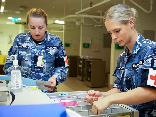 RAAF medical technician Corporal Megan Macauslan (right) carries out a check on the emergency trolley in the North West Regional Hospital in Burnie, Tasmania. Picture: Corporal Nicci Freeman